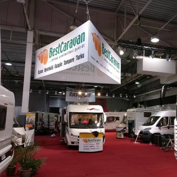 Exhibition booth with overhead advertisements Exhibition booth with overhead advertisements